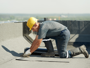 Professional roofing team from UrCovered Constructions fixing a commercial roof in Lebanon"