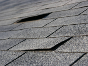 Wind lifted shingles, exposing a Murfreesboro roof to more harm.