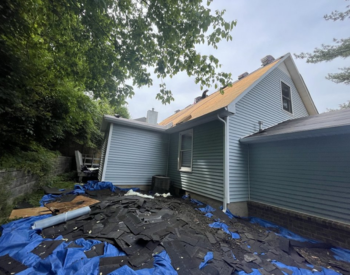 Professional Brentwood roofers completing a summer roof replacement