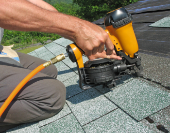 UrCovered Construction roofer installing sustainable roofing materials