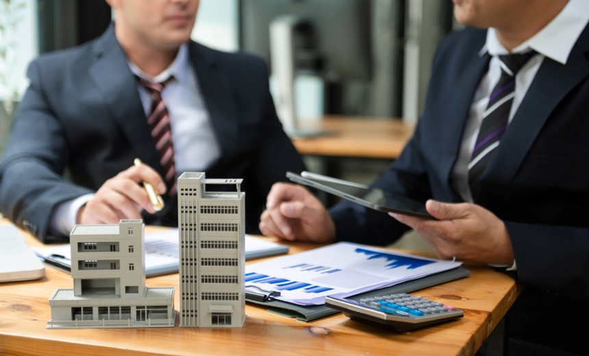 Image of UrCovered Construction owners standing side by side