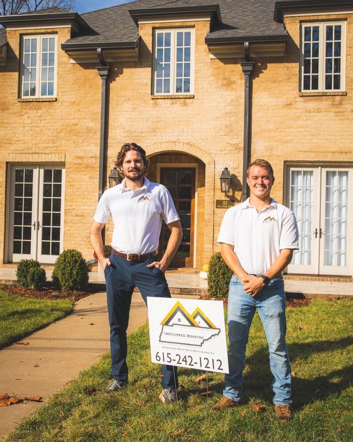 Image of UrCovered Construction owners standing side by side