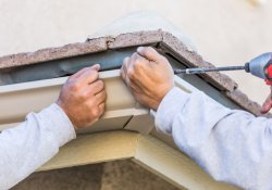 Skilled UrCovered Construction team performing gutter installation in Smyrna, ensuring homes are equipped for effective rainwater management.